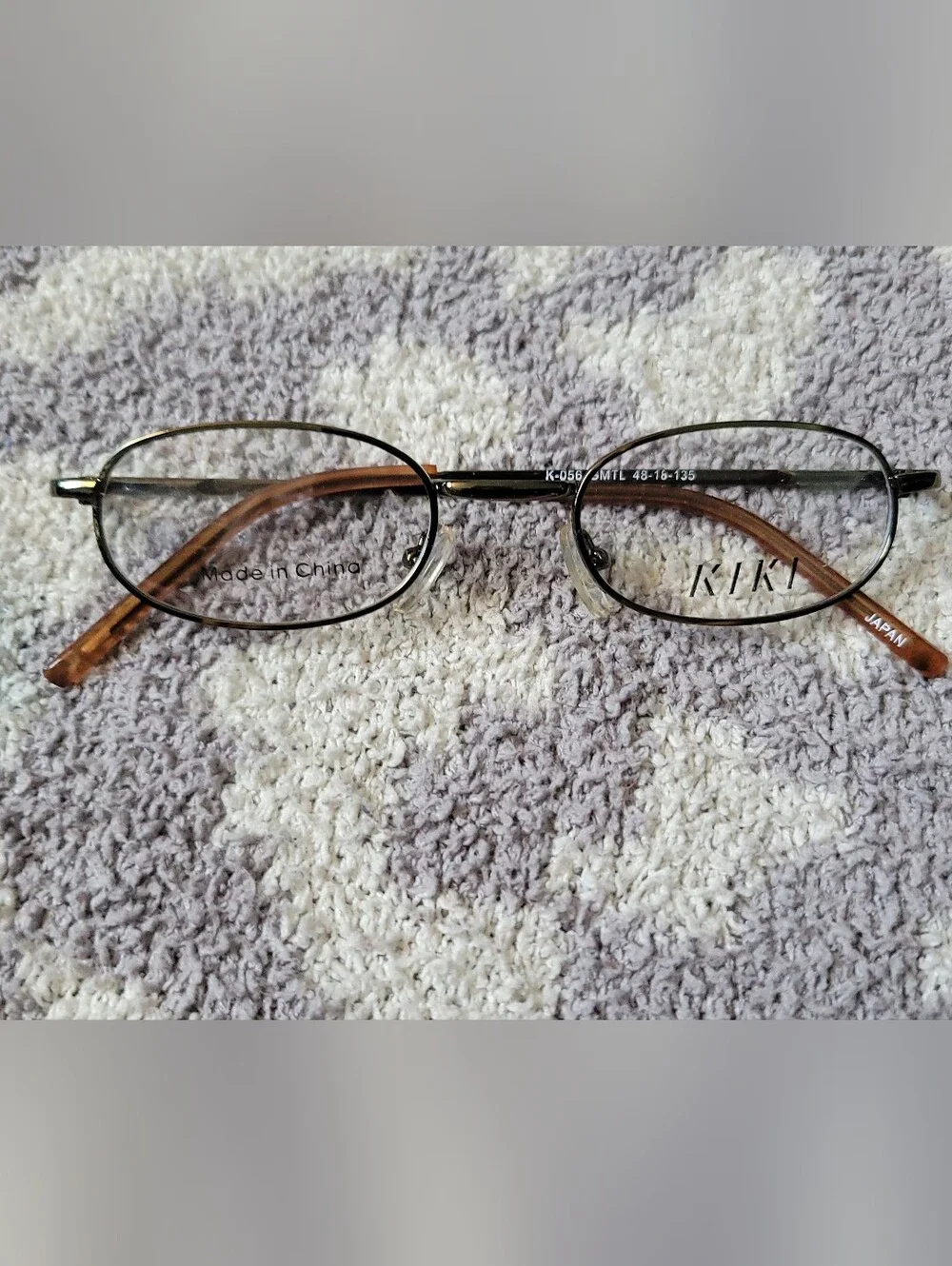 Kids/Youth Kiki Dark Metal Oval Eyeglass Frames 48-18-135 Tortoise Arms